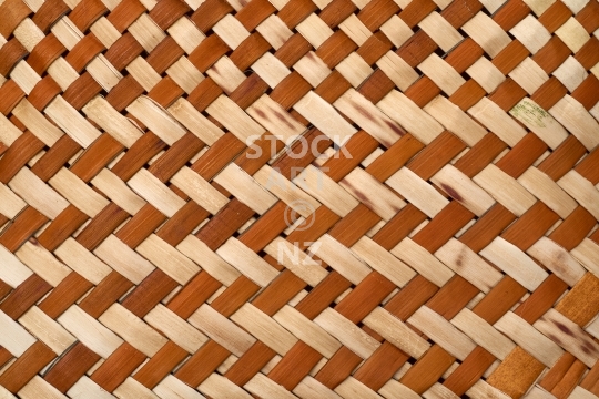 Brown takirua flax weaving - background
