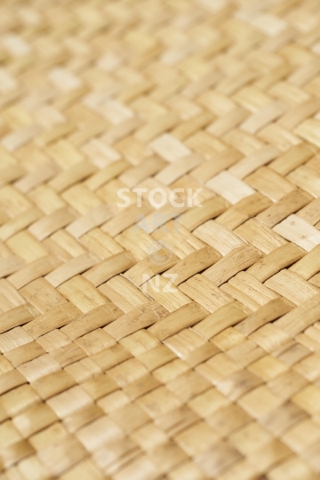 Detailed view of a traditional woven flax mat