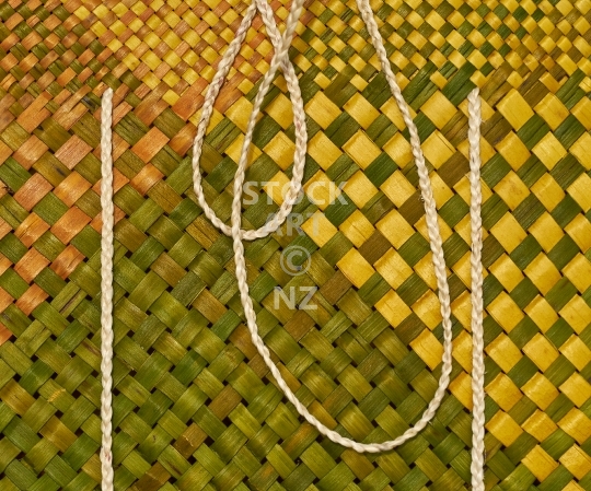 Splashback photo: Yellow and green flax weaving kete 