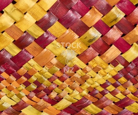 Kitchen splashback image - red, orange and yellow NZ flax weaving