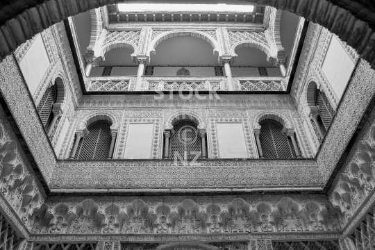 A patio of Seville’s Alcazar Palace - Real Alcazar de Sevilla, in black and white format