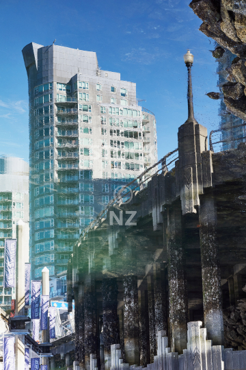 Abstract artistic impression with building reflections in the water at Coal Harbour Marina, Vancouver waterfront