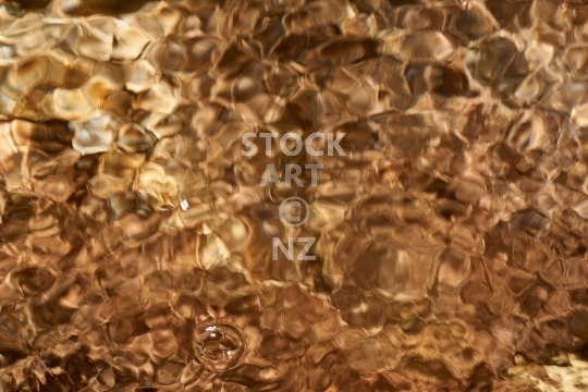Abstract river water surface  - Closeup of a New Zealand bush stream
