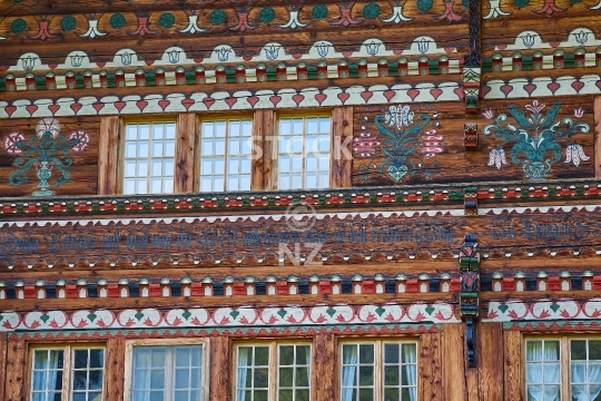 Amazing details of a Swiss chalet, Simmental, Berner Oberland, Switzerland - Intricate wooden house facade in Swiss mountain style