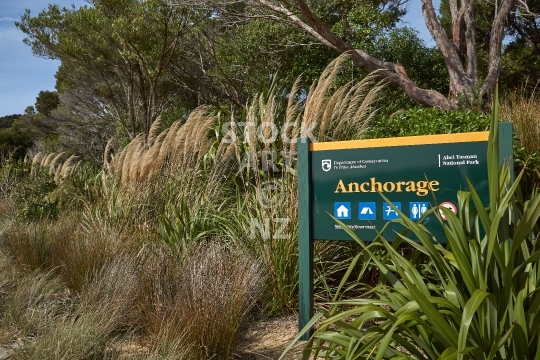 Anchorage beach signpost for hikers on the coastal walkway - Anchorage, Abel Tasman National Park, NZ