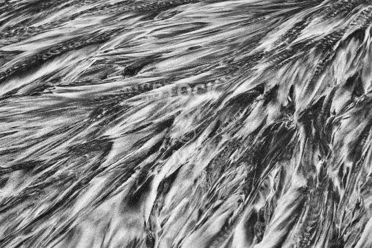 Artistic black and white sand pattern on a Northland NZ beach - Abstract patterns on Ocean Beach in Whangarei