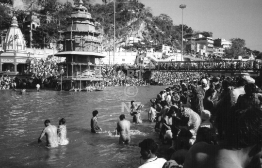 Bathing pilgrims - 1998 Kumbh Mela in Haridwar, India - Vintage low resolution black & white photo of the famous and largest Hindu festival