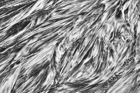 Black and white sand pattern on a New Zealand beach