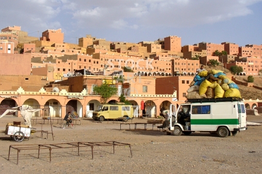 Boumalne in Morocco - Market square with packed bus roof and town buildings, near Dades Gorge in the Atlas mountains - lower resolution stock photo, ideal for web use