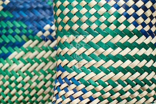 Close up of two blue and green kete or bags