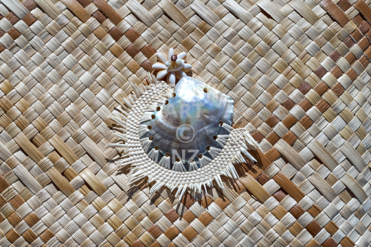 Closeup of a woven Polynesian souvenir - Aitutaki, Cook Islands, Polynesia  - Bag made of pandanus, coconut fibres and mother of pearl shell 