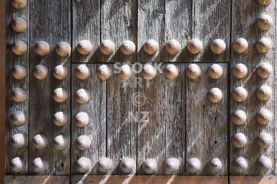 Closeup of an old wooden door  - Ancient Arabic style entrance in Sevilla