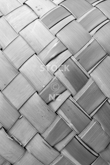 Closeup of flax weaving - Black and white background - raw and unprocessed flax leaves woven into a waikawa