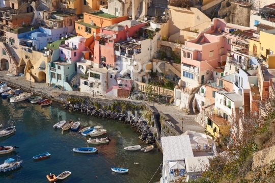 Closeup of Marina Corricella - Procida, Italy - The famous fisherman village Marina Corricella from above, with Greek style houses, Procida Island in the Bay of Naples                               