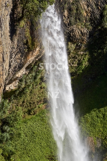 Closeup of the Bridal Veil Falls - Raglan, Waikato, NZ - Gorgeous high waterfall of the Pakoka river with white water spray, near the start of the Pipiwharauroa walking track