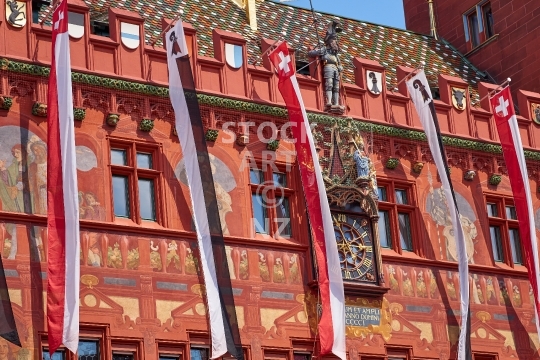 Closeup of the old Basel Town Hall building in Basel, Switzerland - One of Basels main attractions - detailed view of the 500 year old middle section with clock, flags and figures
