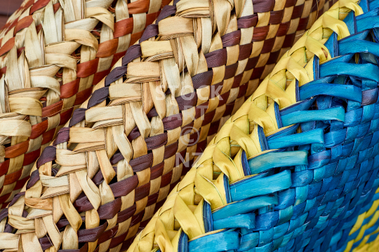Colourful flax weaving closeup - Detail view of a group of kete 