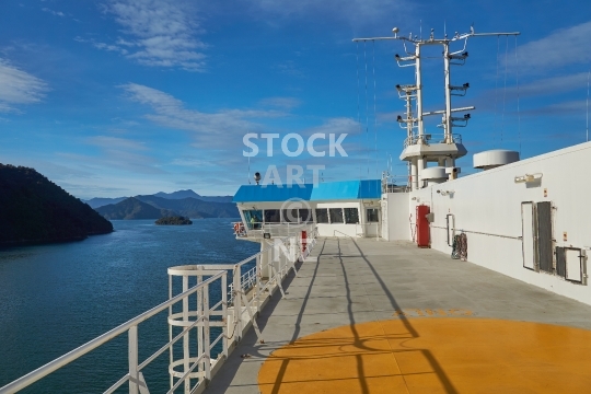 Cook Strait ferry between Wellington and Picton, New Zealand - Ferry deck and bridge with the beautiful Marlborough Sounds in the background