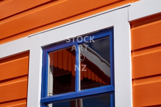 Detail of a heritage house in Foxton NZ - A lovely freshly painted weatherboard building with window reflections in the little Manawatu village