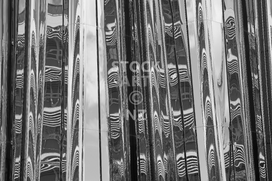 Glassy mirror reflection on the facade of New Plymouth - Abstract black & white close up of the building 
