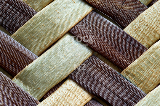 Macro closeup of flax weaving - Raranga harakeke, detail of brown and natural whenu