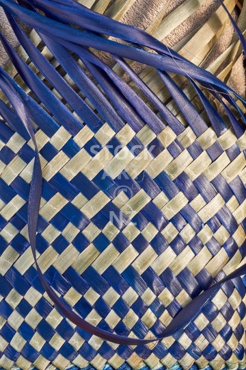 Making of a pikau - New Zealand flax weaving - Unfinished work in progress with blue and natural flax strands
