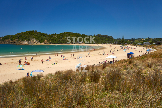 Matapouri Bay in summer full of people