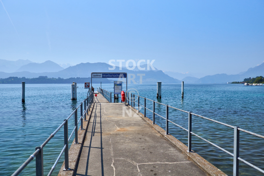 Merlischachen lake pier - Beautiful view of Lake Lucerne with blue sky and water