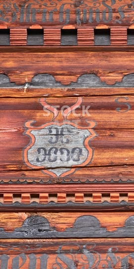 Mobile wallpaper: Closeup of a painted Swiss Simmental chalet