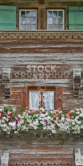 Mobile wallpaper: Closeup of a Swiss chalet - Swiss themed phone background picture, screen size ratio 18:9 (or fitting anything between 16:9 - 20:9)