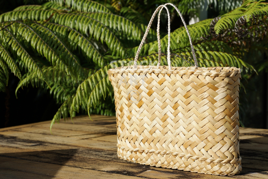 Natural flax kete - Handmade bag made of woven flax, a traditional Maori art in New Zealand (with property release from the artist)