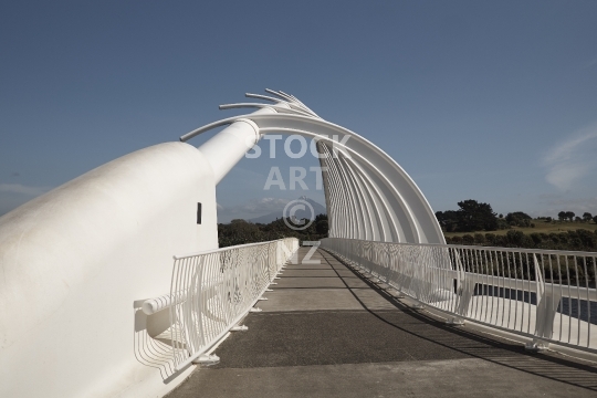 New Plymouths beautiful Te Rewa Rewa bridge - In the shape of a whale carcass, with a view leading to Mount Taranaki, New Plymouth, New Zealand                               