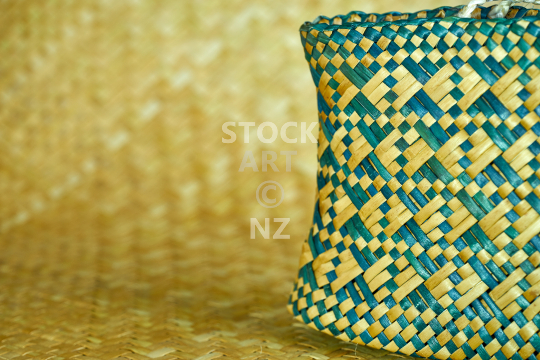 New Zealand kete whakairo with papakirango pattern and whariki background - Flax weaving: patterned bag and mat (with artist property release)