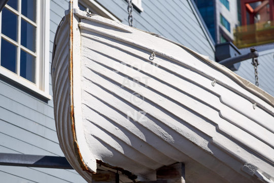 Old white rowing boat as decoration on the Wellington waterfront promenade, NZ