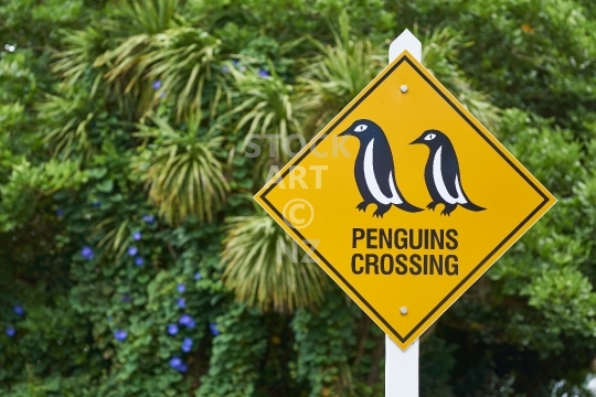 Penguins crossing sign in New Zealand - Cute and funny street sign warning about the local wildlife - Mangonui, Northland                               