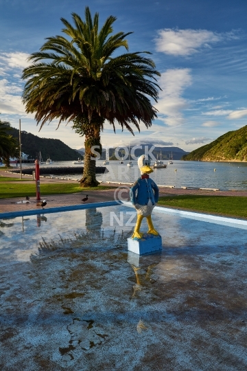Picton playground on the waterfront - Funny Donald Duck pool and big palm tree in the bay - Marlborough Sounds, NZ