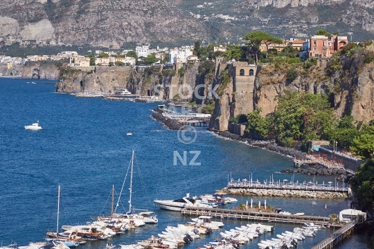 Picturesque Sorrento sea cliff view - Gulf of Naples, Italy - Lookout view of the marina with houses and boats