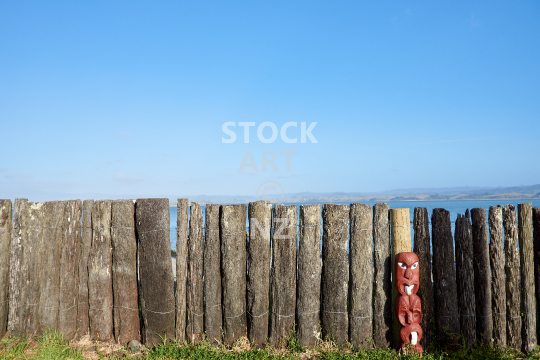 Ponga fence near Kawhia marae - Traditional fence made of tree ferns beside the beautiful Kawhia Harbour
