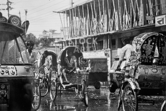 Rickshaw drivers in Dhaka, Bangladesh - Waiting for passengers after the rain - old black & white vintage low resolution photo from 1992