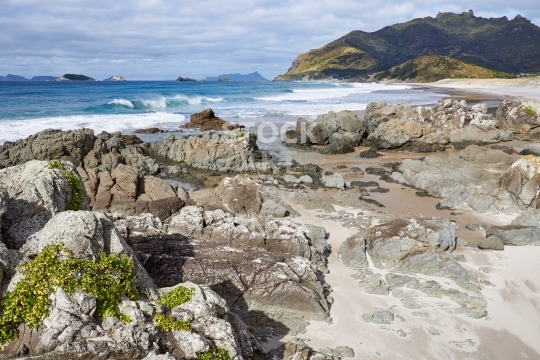 Rocks and waves at Ocean Beach, Whangarei - Fresh and pure with Bream Head in the background