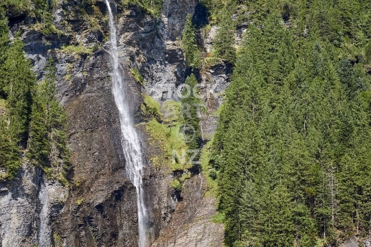 Rosenlaui Valley, Bernese Oberland region, Switzerland - Steep alpine waterfall landscape in the Swiss mountains