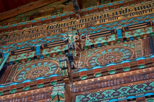 Swiss chalet, Simmental, Bernese Oberland, Switzerland - Closeup of an intricately painted and carved wooden chalet