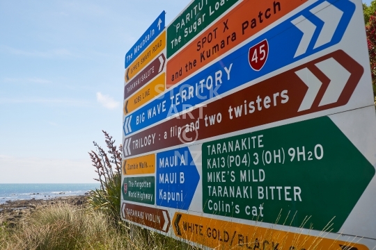 Taranaki Surfing Highway 45 signs - Big wave territory: iconic road signs for the Surfing Highway 45 for surfers - Taranaki, New Plymouth, New Zealand                               