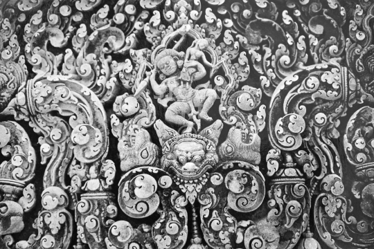 The abduction of Sita - Banteay Srei temple, Angkor - Amazing 10th century sandstone temple, carved lintel relief depicting a scene from the Ramayana, located outside of Angkor Wat and probably the finest small temple of all - black & white vintage low resolution photo from March 1992