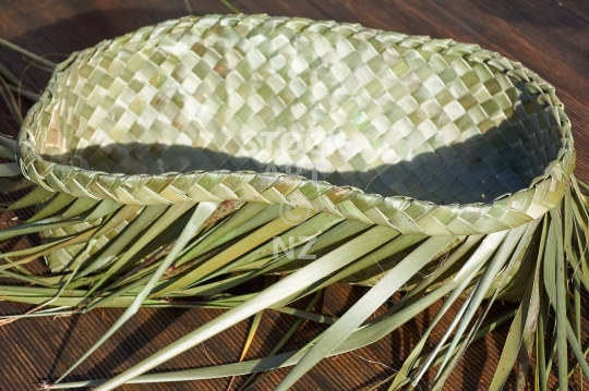 Wahakura, a woven Maori baby cot - New Zealand flax weaving solution for safe co-sleeping in bed